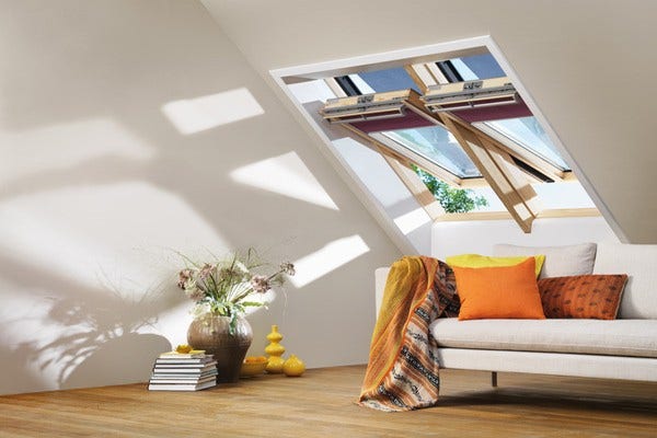 VELUX roof window for loft conversion with purple VELUX blinds